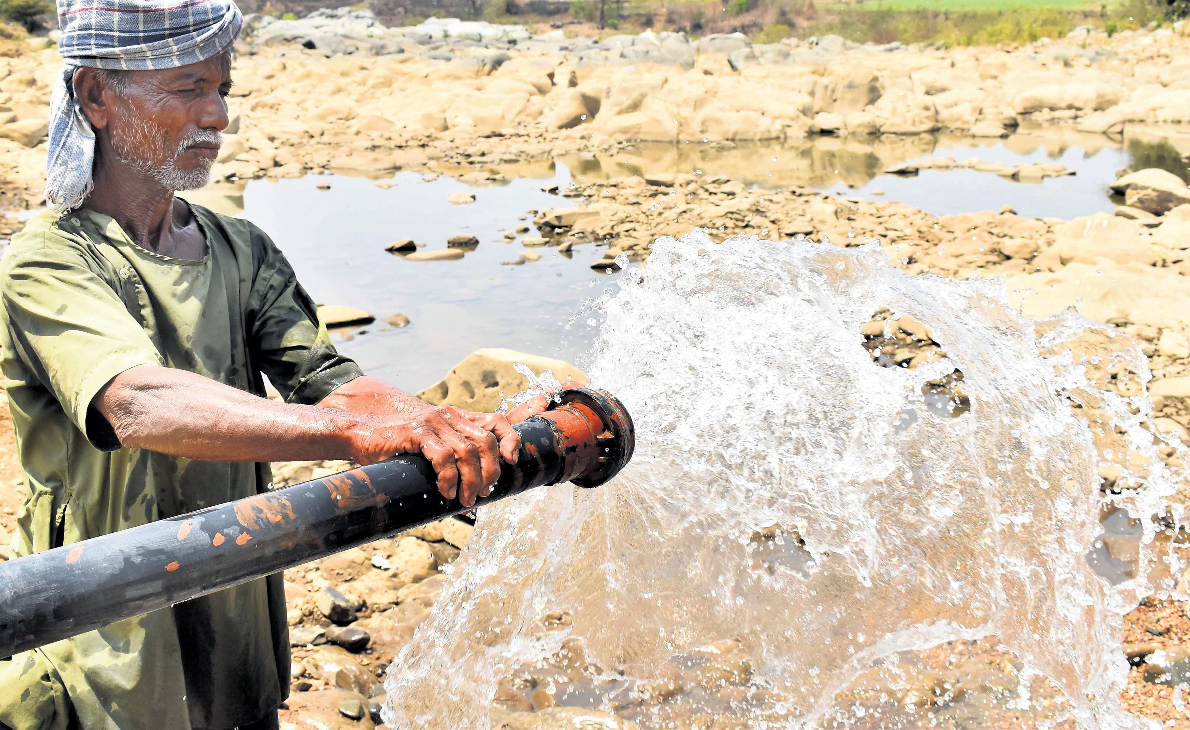 Farmer Helps Out Thirsty Animals